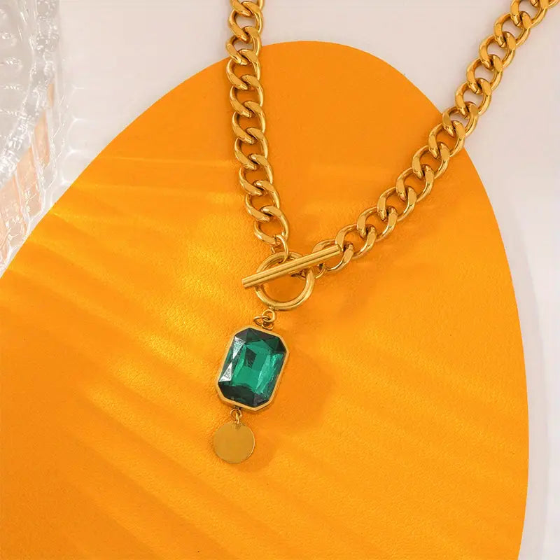 Goldene Kettenhalskette mit Smaragd