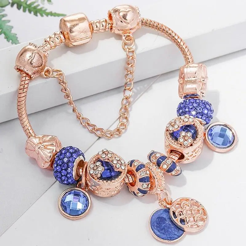 Roségoldenes Armband mit blauem Kristall